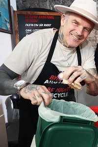Matt putting peelings into a food waste caddy in the kitchen