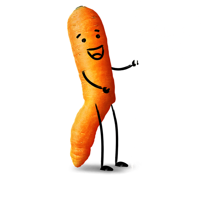 A carrot with a cartoon face waving a Welsh flag