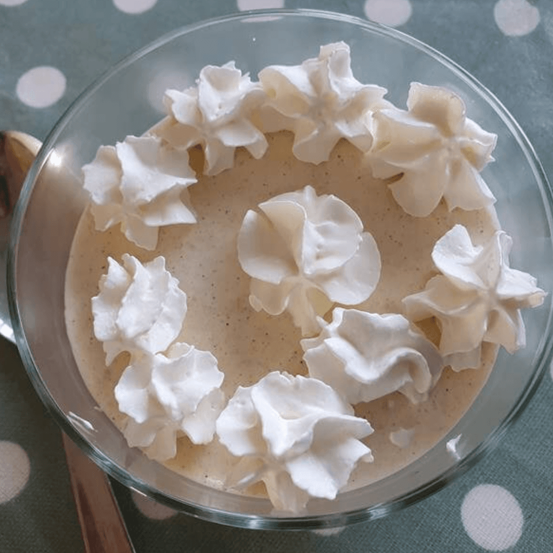 Pumpkin Mousse topped with cream swirls.