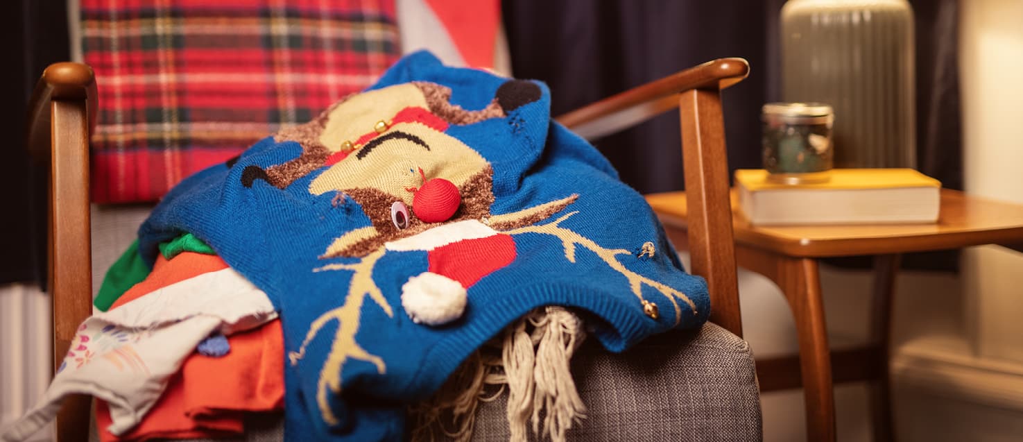 Blue Christmas jumper on an armchair