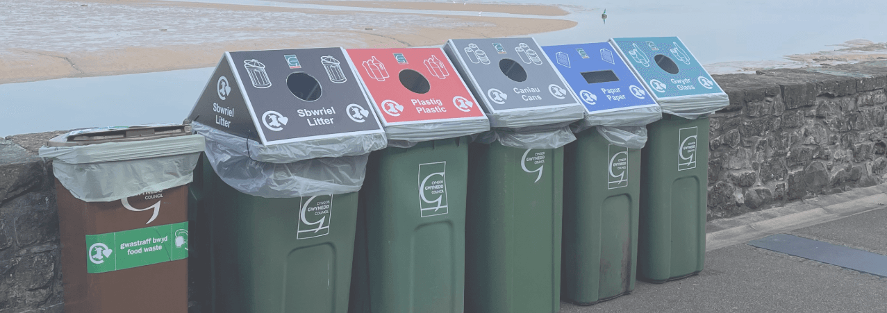 Recycling bins by the beach in Wales.